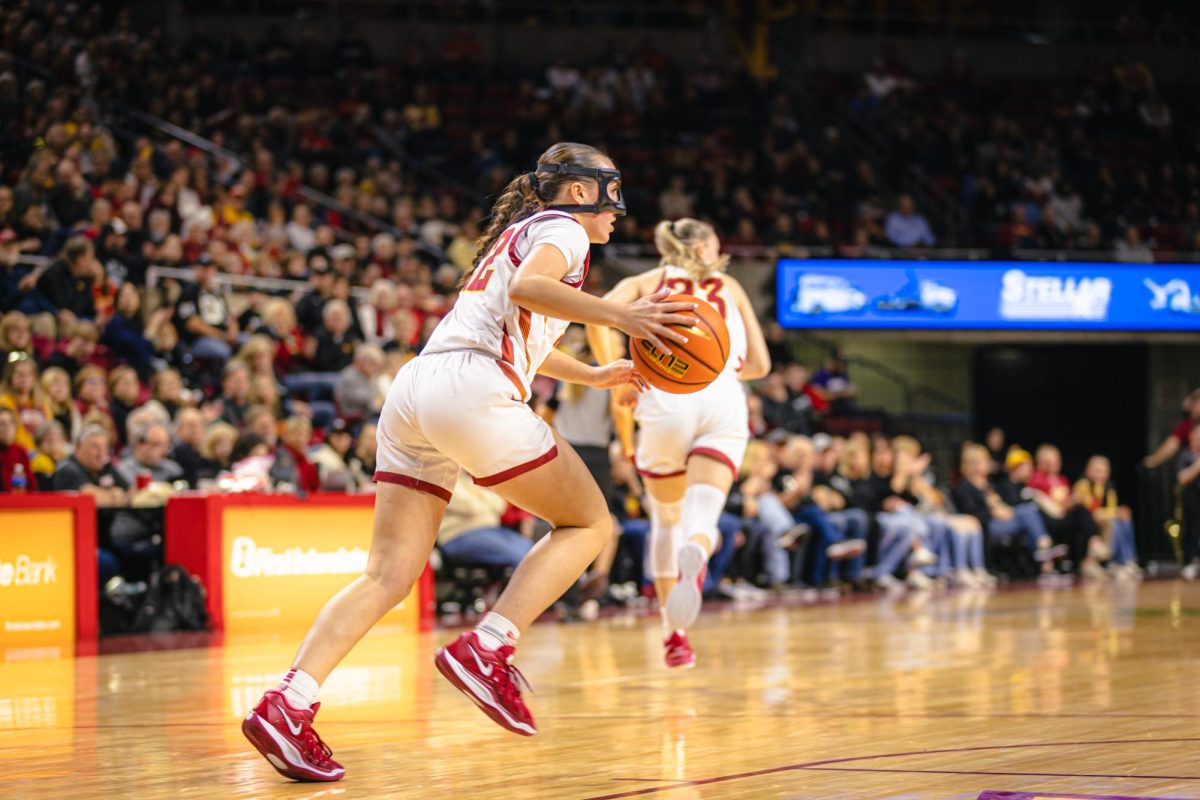 Reagan Wilson (22) brings up the ball during the Iowa State vs. University of Kansas NCAA women's basketball game at Hilton Coliseum on Wednesday, Jan. 1, 2025, in Ames, Iowa.