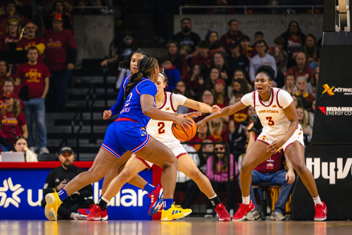 Alisa Williams (3) plays defense against a Kansas player during the Iowa State vs. University of Kansas NCAA women's basketball game at Hilton Coliseum on Wednesday, Jan. 1, 2025, in Ames, Iowa.