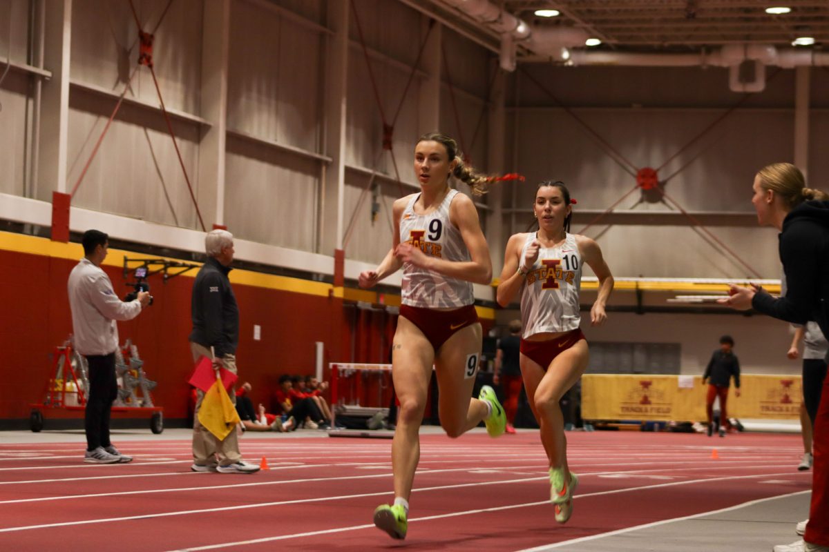 Riley Beach (front) and Maelle Porcher running the women's mile at the Iowa State Cyclone track and field Open at Lied Recreation Center, Ames, Iowa, Jan. 24, 2025. 