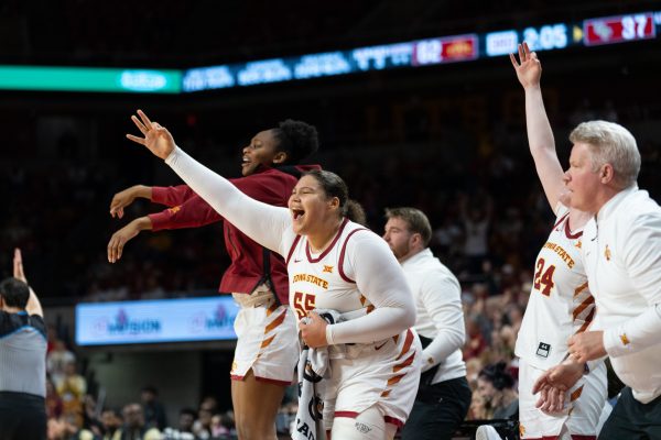 Alisa Williams (3) and Audi Crooks (55) celebrate scoring a point from the sideline during the game vs. University of Central Florida, Hilton Coliseum, Ames, Iowa, Jan. 25, 2025.