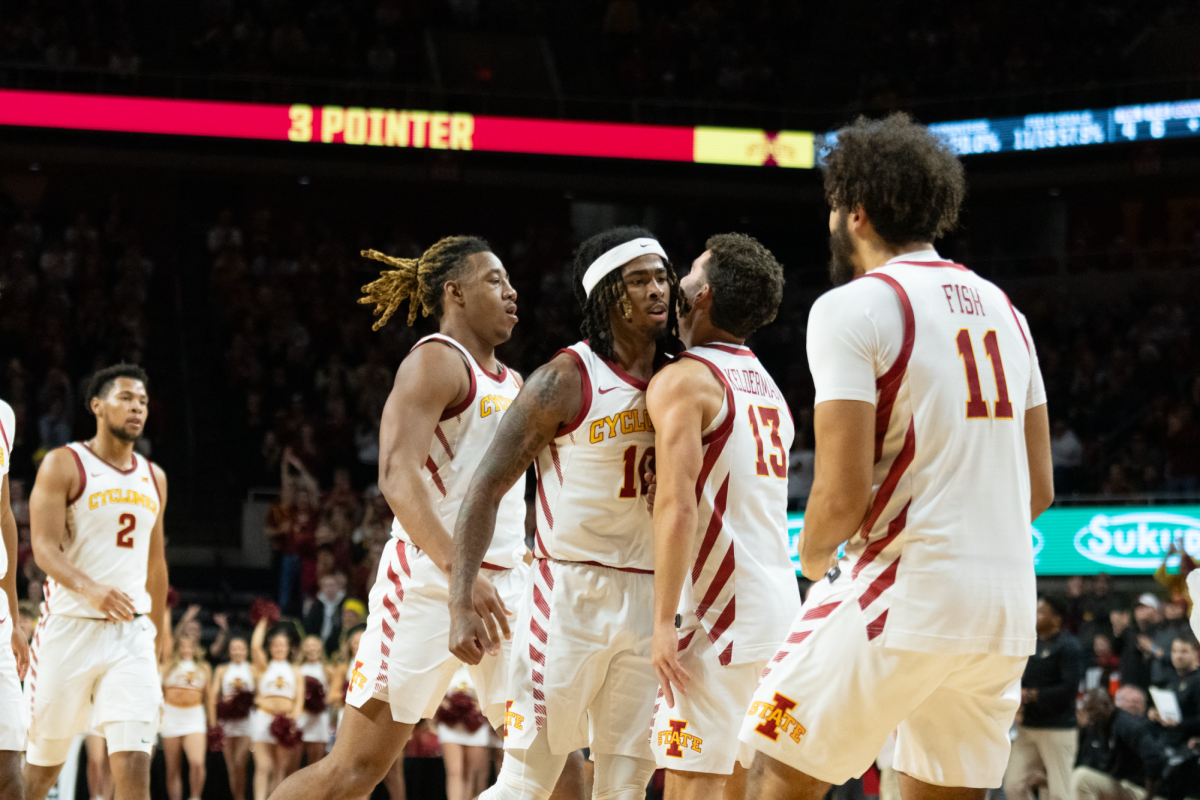 Keshon Gilbert (10) and Cade Kelderman (13) celebrate against the University of Central Florida, Jan. 21, 2025, Hilton Coliseum, Ames, Iowa.