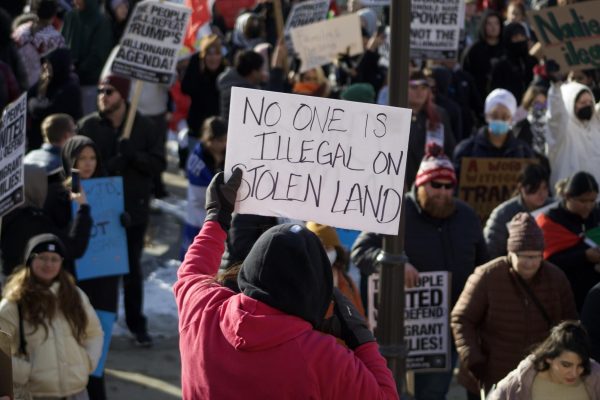 "No one is illegal on stolen land" signage outside a protest in front of the Iowa State Capitol on January 25, 2025