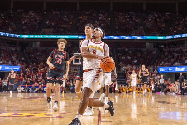 Tamin Lipsey (3) goes for the breakaway layup after the Cyclones successfully steal the ball during the second half of the Iowa State vs. University of Utah game in Hilton Coliseum in Ames, Iowa on Jan. 7, 2025.  