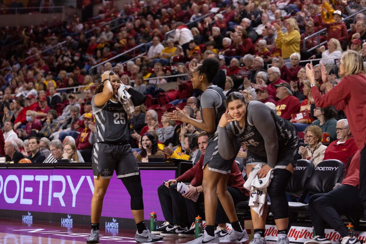 Iowa State Women's Basketball players Sydney Harris (25), Alisa Williams (3), and Audi Crooks (55) celebrate after a successful three is thrown up close to the end of the second half of the game against BYU at Hilton Coliseum, Ames, Iowa, Jan. 22, 2025.