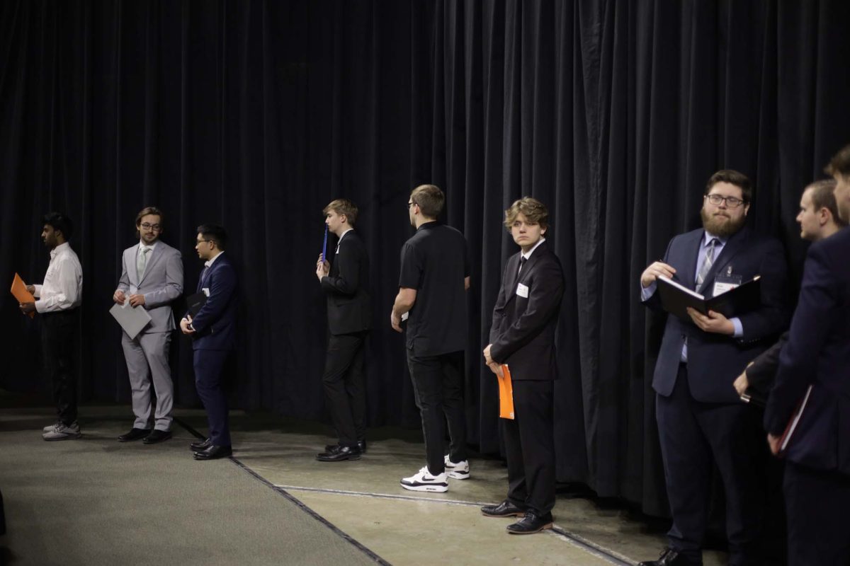 A group of students waiting in line to talk to a company at the Iowa State Engineering Career Fair in Hilton Coliseum on Feb. 11, 2025, Ames, Iowa.