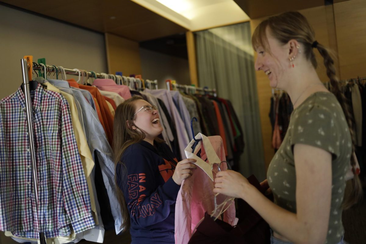 Catherine Cave, freshman in aerospace engineering, with Karina Scott, sophomore in civil engineering, at  the Free Business Attire Pop-Up Shop in the Multicultural Canter at the Memorial Union Feb. 6, 2025.