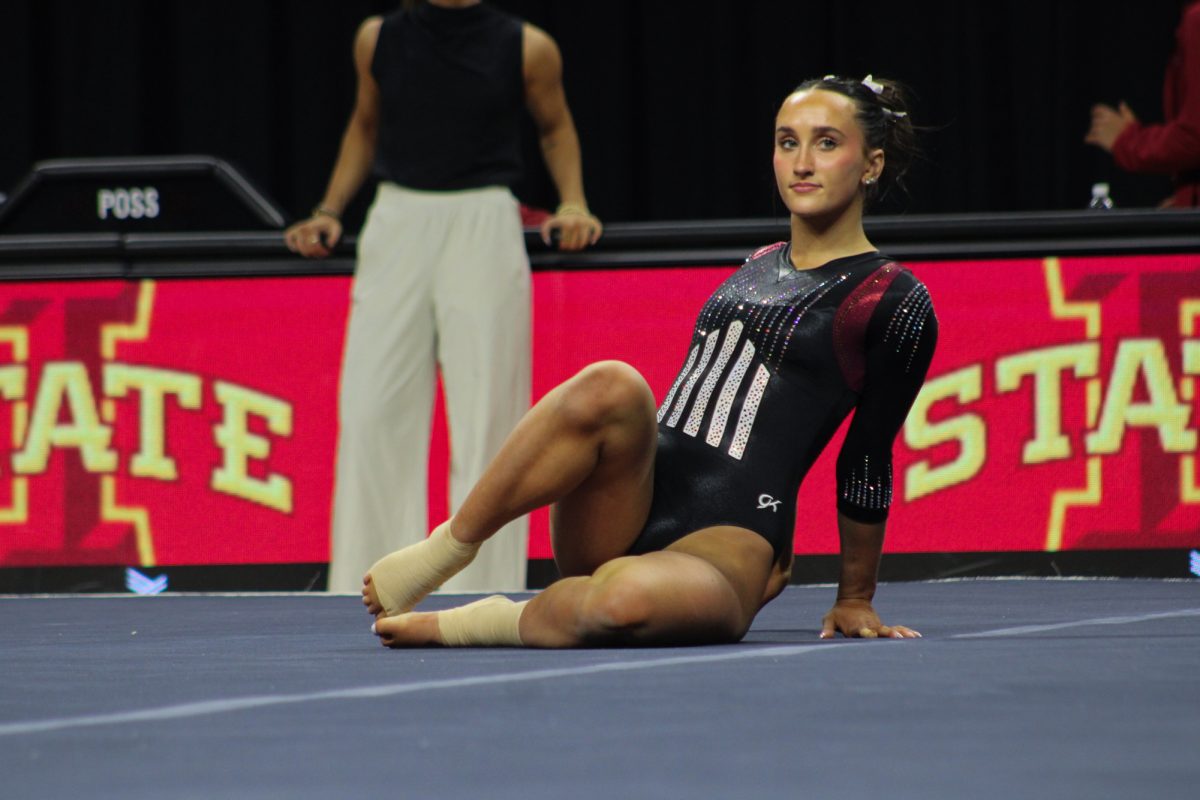 Ella Schell posing at the beginning of her floor routine during the meet against Brigham Young University on Feb. 21, Hilton Coliseum, Ames, Iowa. 