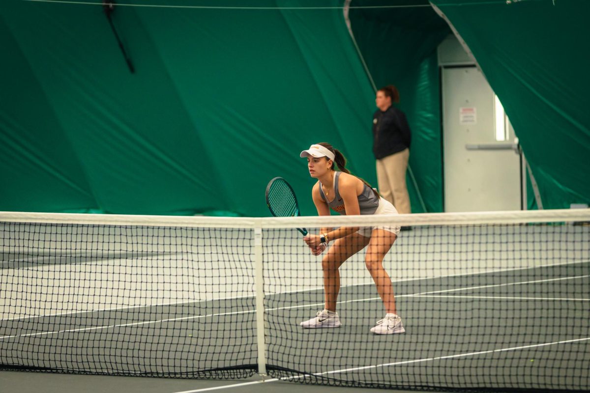 Christina Ramos Sierra is ready at the net during the Iowa State University vs. University of Wyoming tennis meet, Feb. 8, 2025, Iowa State Tennis Center, Ames, Iowa. 