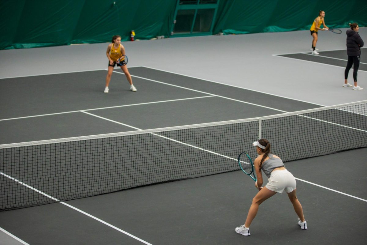 Christina Ramos Sierra is ready at the net during the Iowa State University vs. University of Wyoming tennis meet, Feb. 8, 2025, Iowa State Tennis Center, Ames, Iowa. 