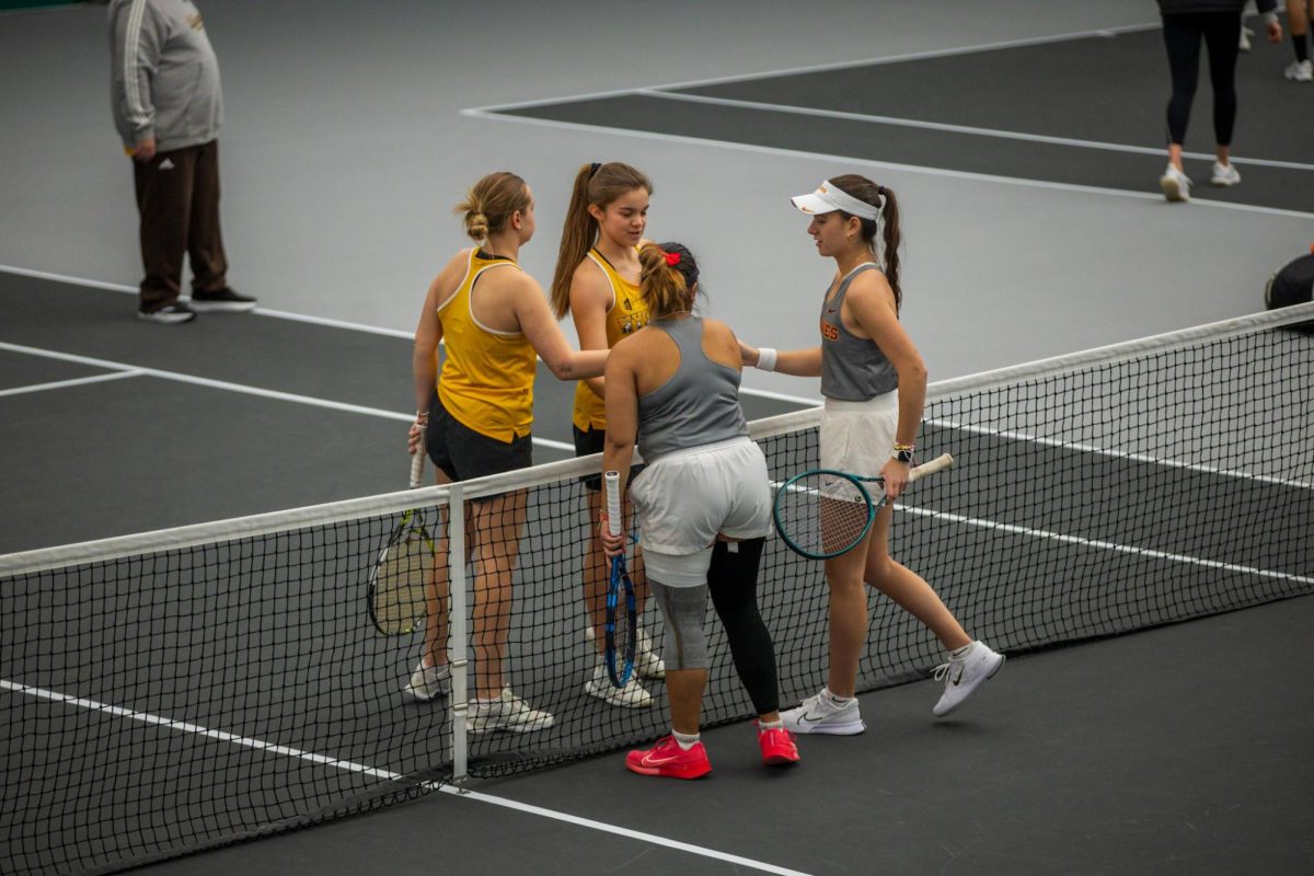 Anna Supapitch Kuearum and Christina Ramos Sierra during the Iowa State University vs. University of Wyoming tennis meet, Feb. 8, 2025, Iowa State Tennis Center, Ames, Iowa. 