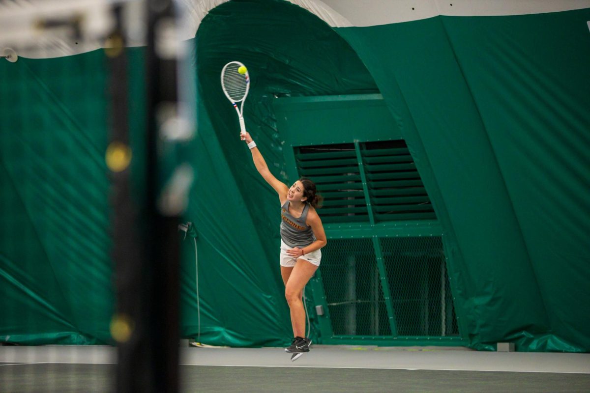 Mari Paz Alberto Vilar serves the ball during the Iowa State University vs. University of Wyoming tennis meet, Feb. 8, 2025, Iowa State Tennis Center, Ames, Iowa. 