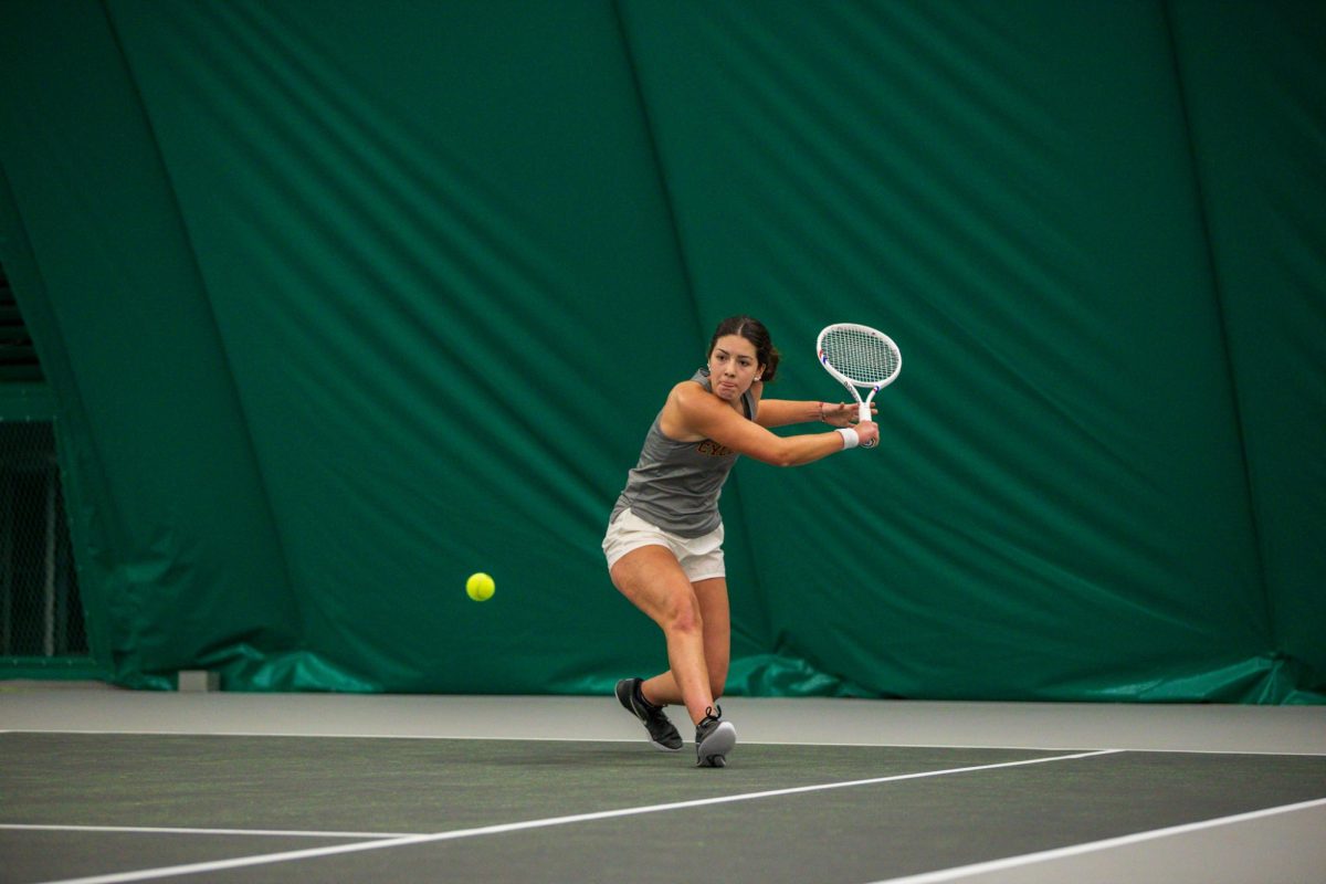 Mari Paz Alberto Vilar goes to slice the ball during the Iowa State University vs. University of Wyoming tennis meet, Feb. 8, 2025, Iowa State Tennis Center, Ames, Iowa. 