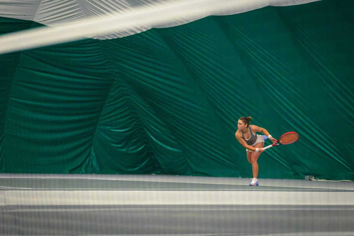 Gabriela Felix serves during the Iowa State University vs. University of Wyoming tennis meet, Feb. 8, 2025, Iowa State Tennis Center, Ames, Iowa. 