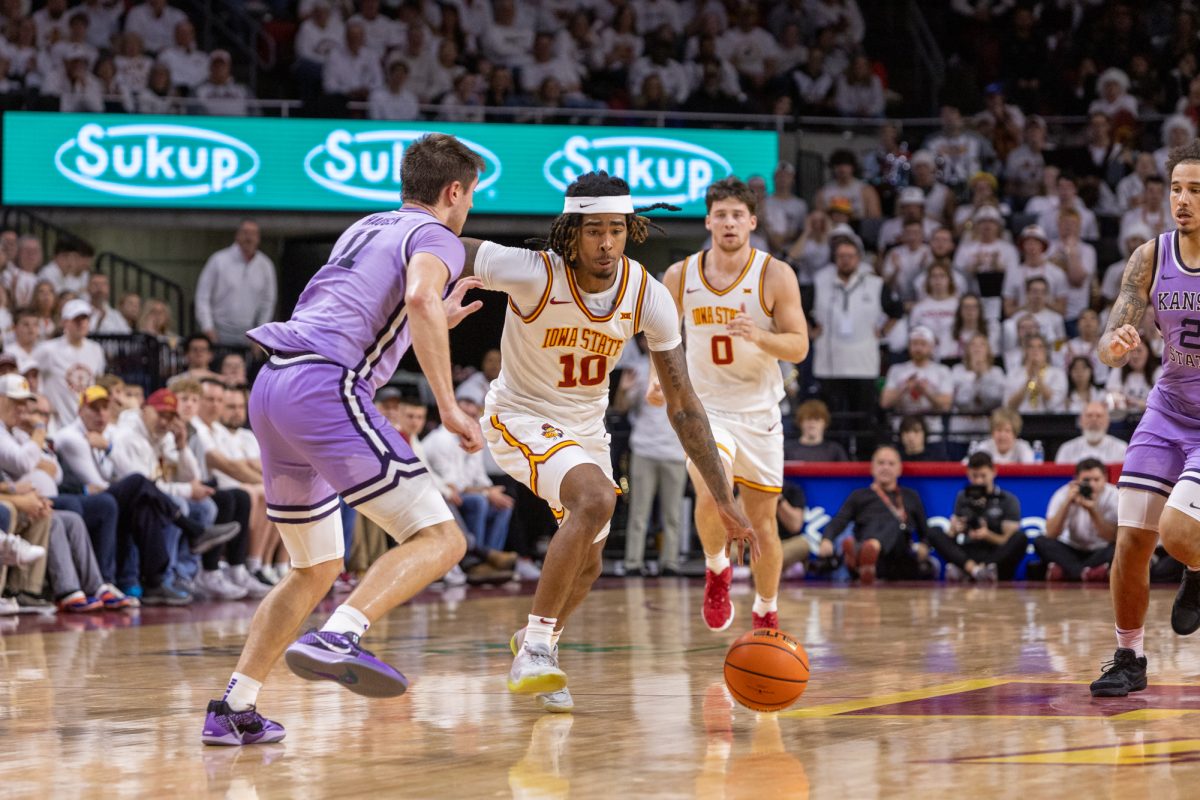 Keshon Gilbert (10) cuts towards the hoop while being guarded by Brendan Hausen (11) at the start of the second half of the game against Kansas State, at Hilton Coliseum, in Ames, Iowa, on Feb. 1, 2025.