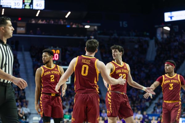 Nate Heise (0) and his teammates all high-five each other during the Iowa State vs. Kansas State University men’s basketball game at Bramlage Coliseum, March 8, 2025, Manhattan, Kansas.