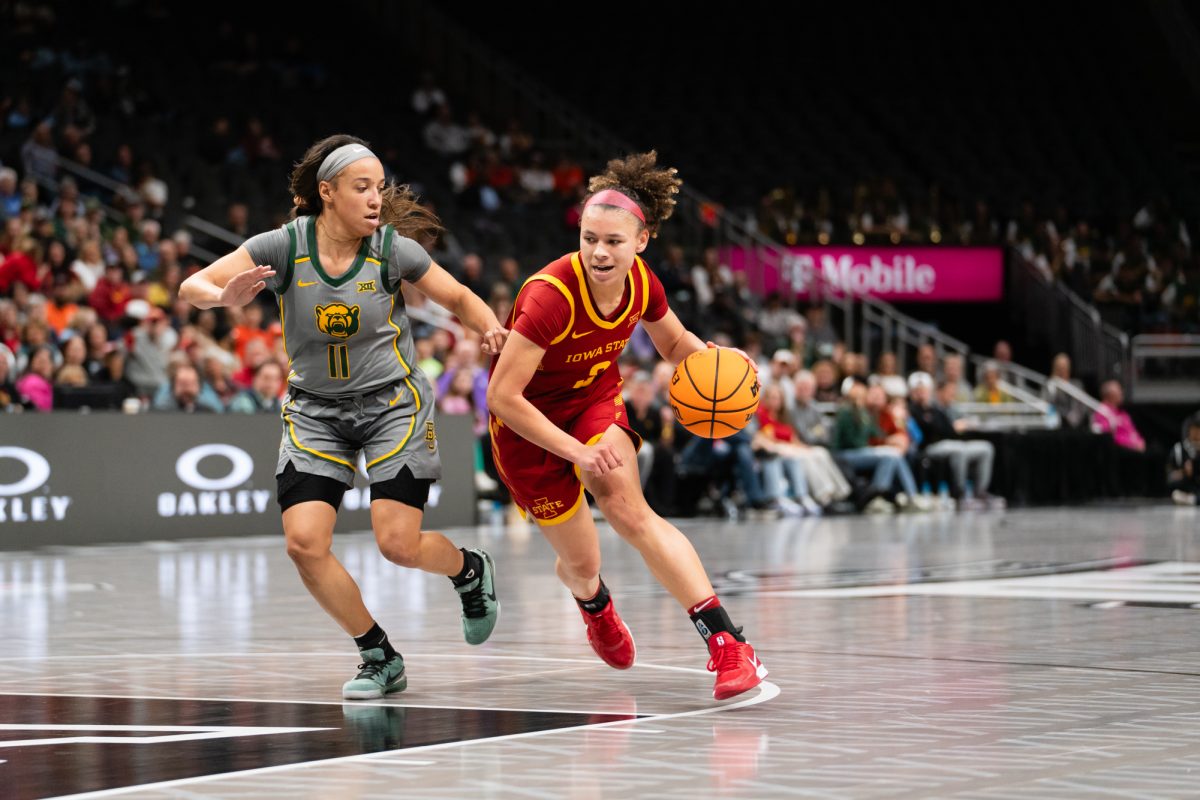 Arianna Jackson (2) moves the ball toward the paint while being defended by Baylor guard Jada Walker (11) at the Iowa State University vs. Baylor University Big 12 tournament women's basketball game, T-Mobile Center, Kansas City, Missouri, March 7, 2025.