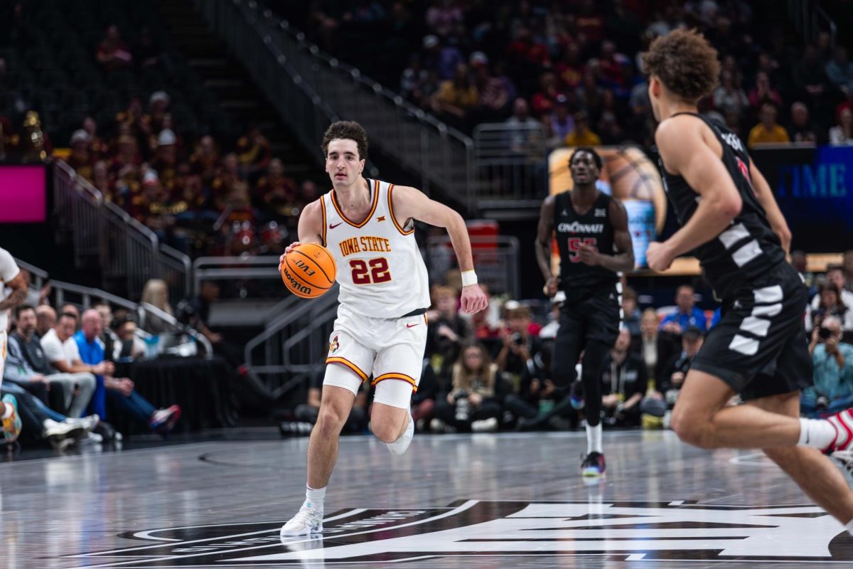 Milan Momcilovic (22) dribbles the ball up the court during the Iowa State vs. the University of Cincinnati men’s basketball game during the Big 12 Tournament at T-Mobile Arena, March 12, 2025, Kansas City, Missouri.