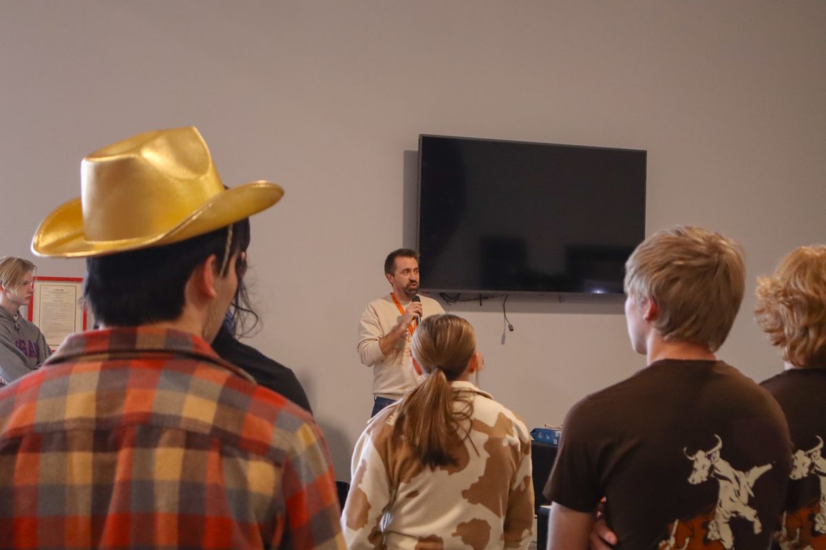 Mark Messner, owner of rendezvous climbing gym, announces the rules and regulations. Taken on Mar. 1, 2025, at Rendezvous Climbing Gym, Kansas City.