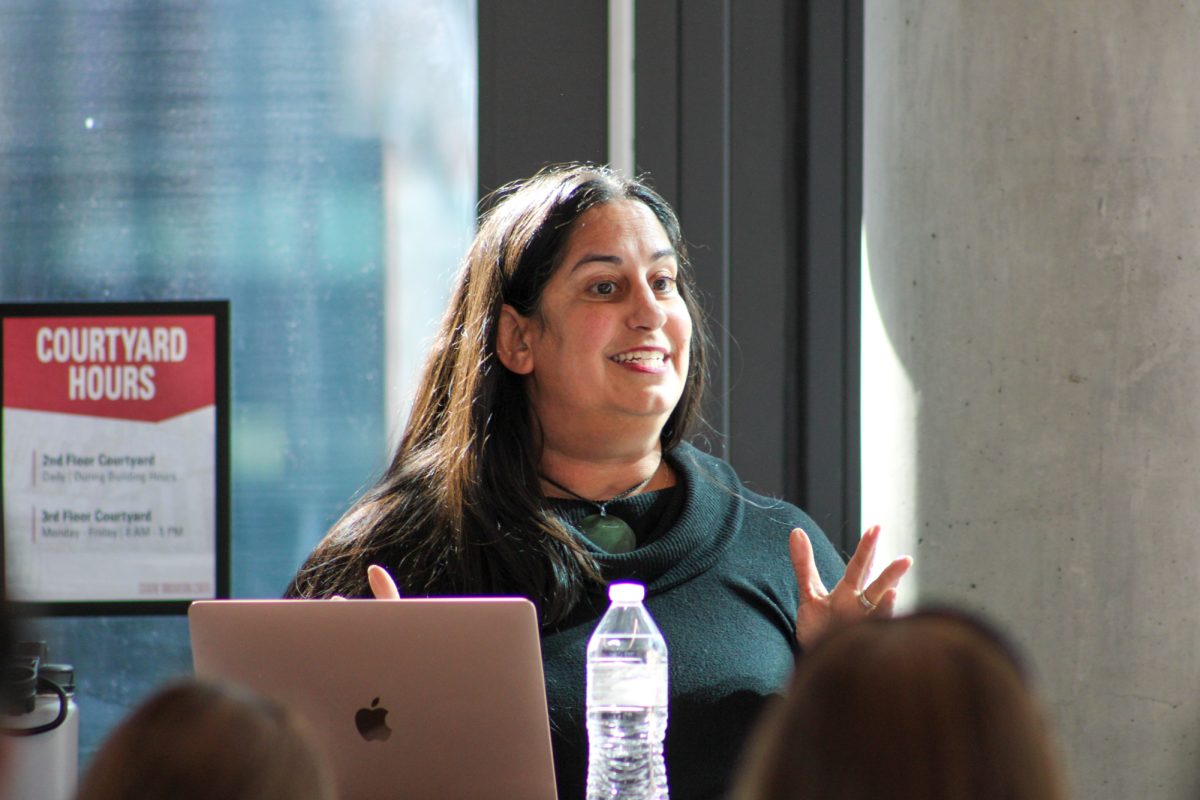 Keynote speaker Seema Clifasefi speaking at the Homelessness Symposium in the Student Innovation Center, Mar. 12, 2025, Ames, Iowa.