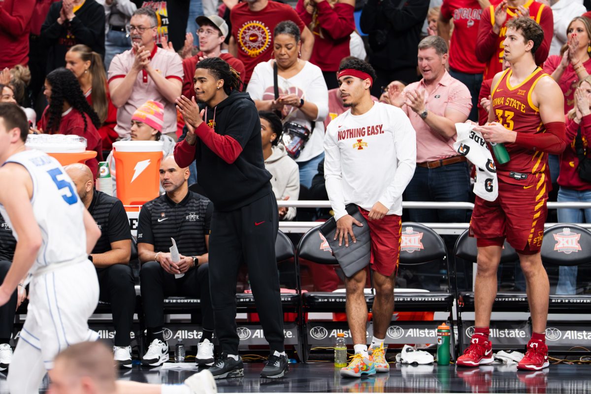 Tamin Lipsey and Keshon Gilbert cheer on their teammates after sitting out from groin strains at the Iowa State vs. the University of Cincinnati men’s basketball game during the Big 12 Tournament at T-Mobile Arena, March 13, 2025, Kansas City, Missouri.