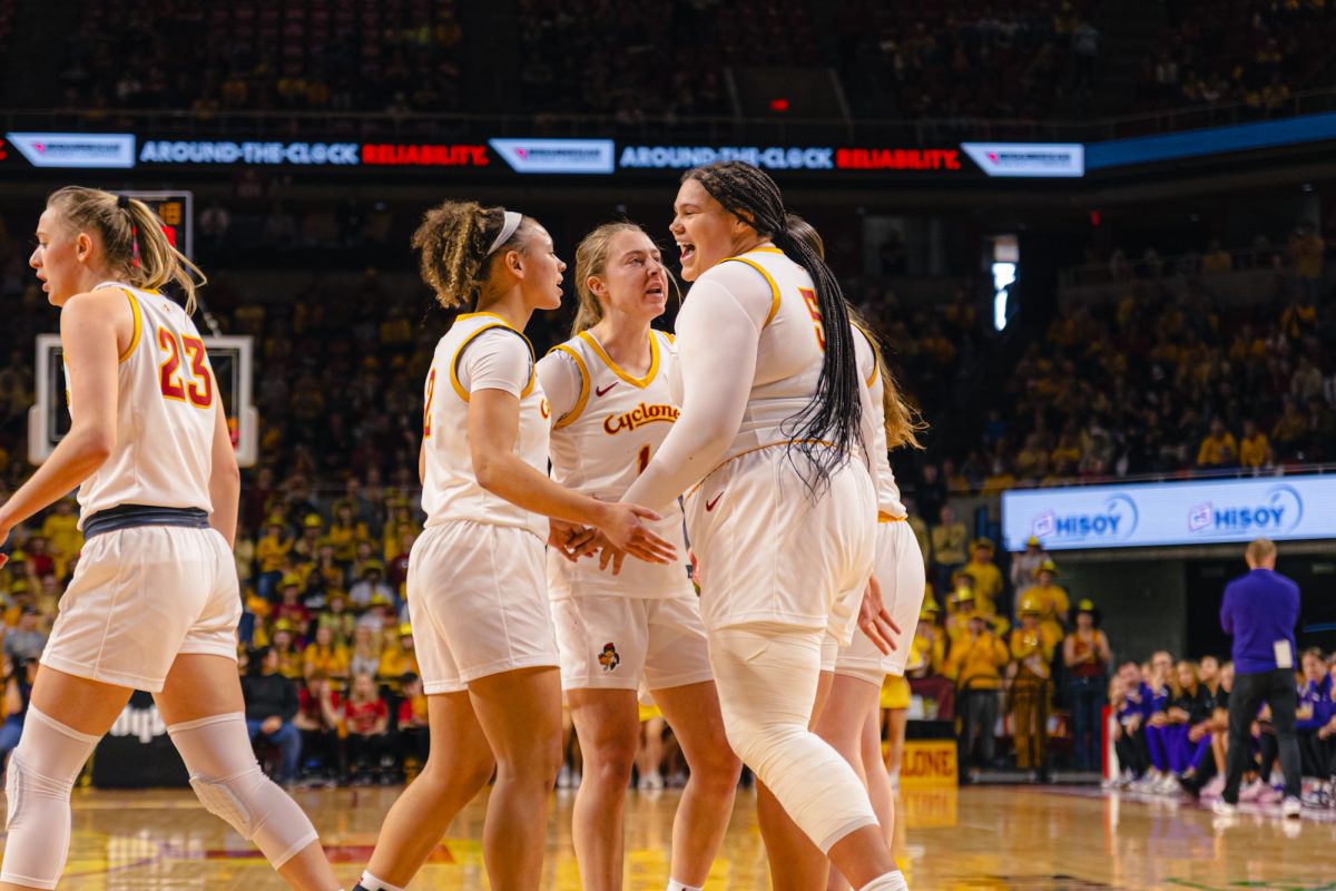 Audi Crooks (55) and her teammates during the Iowa State University vs. Kansas State University basketball game at Hilton Coliseum on Sunday, March. 2, 2025, in Ames, Iowa.