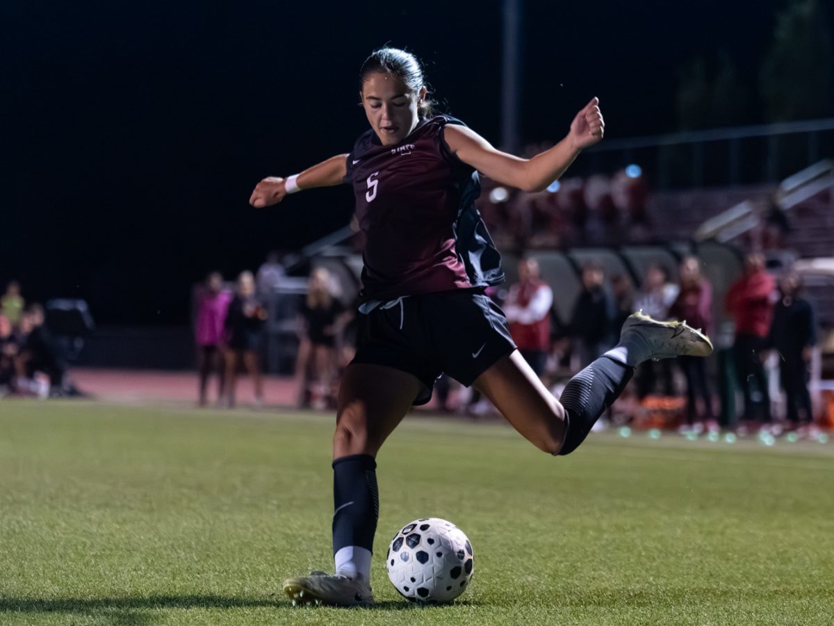 Megan Walters (5) attempts to cross the ball during the soccer game against the University of Arizona at the Cyclone Sports Complex in Ames, Iowa, Sept. 18, 2025.