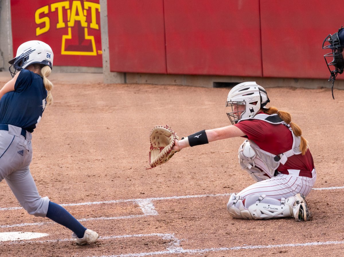 Karlee Ford (9) Reaches for Ball while at catcher, Sept. 21, Iowa State Sports Complex, Ames, Iowa