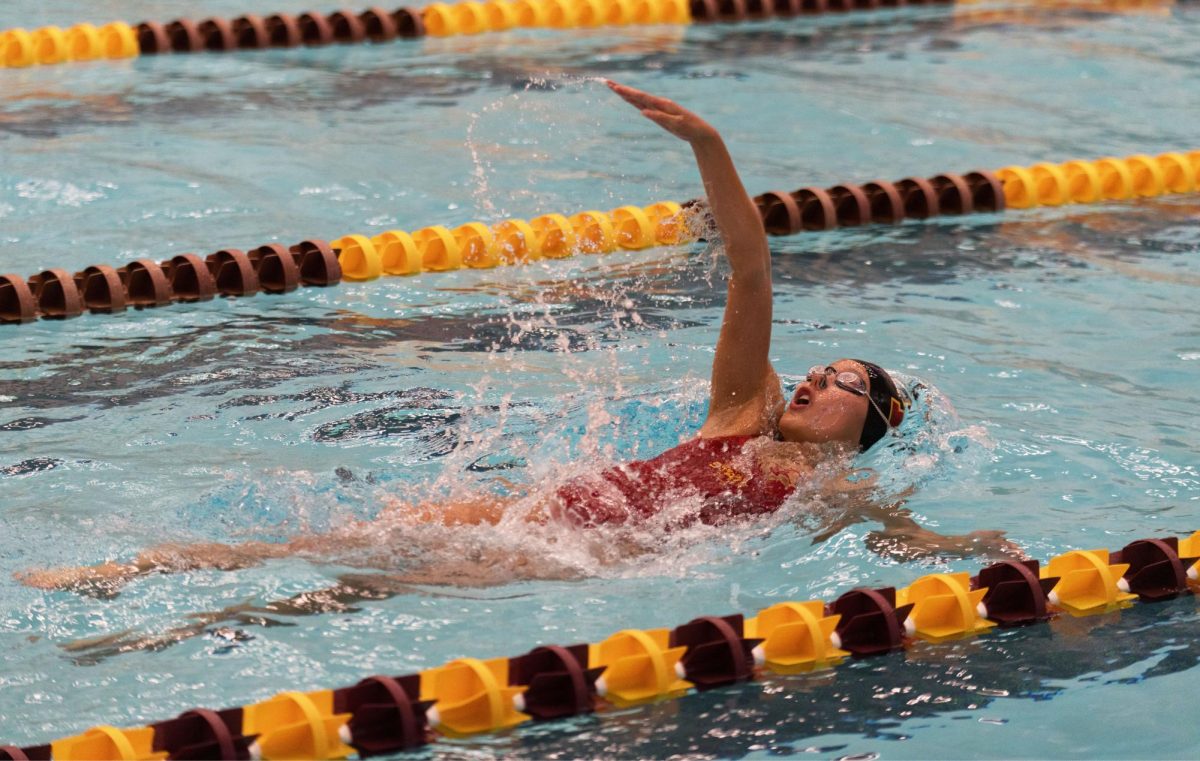 An Iowa State swimmer competes in the backstroke event at Beyer Hall Pool, Ames, Iowa, Oct. 3, 2025.