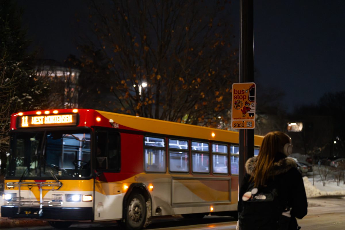 The Upper Friley Cyride bus stop as a bus on Route #11 passes at night in Ames, Iowa on Dec. 8th, 2025.