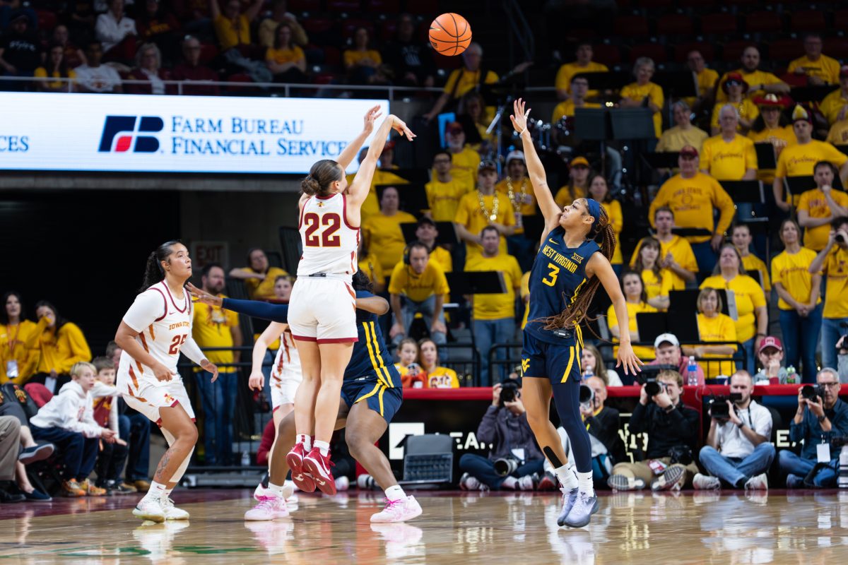 Reagan Wilson (22) takes a shot for three during the Iowa State vs. West Virginia game, Hilton Coliseum, Ames, Iowa, Jan. 11, 2026.
