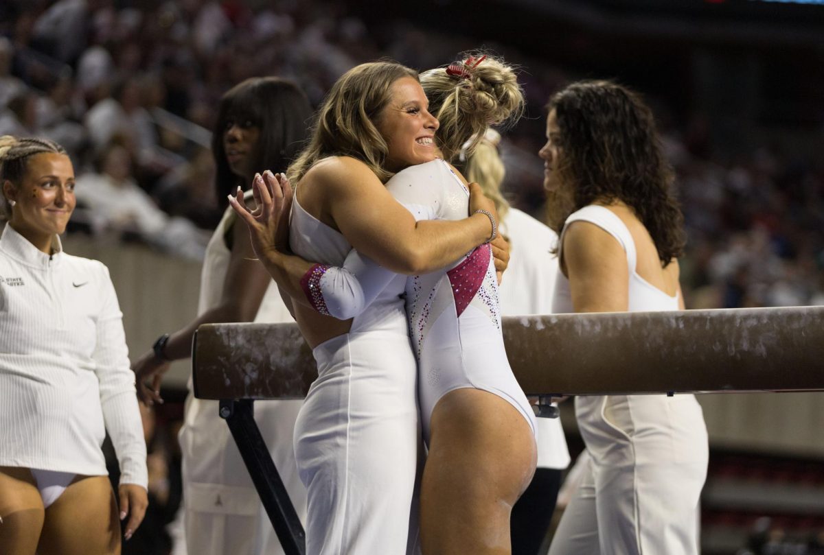 Finley Weldon hugs a supporter during the Iowa State gymnastics meet against the University of Utah, Jan. 25, 2025, Hilton Coliseum, Ames, Iowa. 