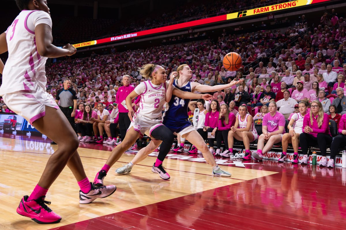 Arianna Jackson (2) reaching for the ball before it falls out of bounds. Iowa State vs. Kansas State. Hilton Coliseum, Ames, Iowa, Feb. 15, 2026.