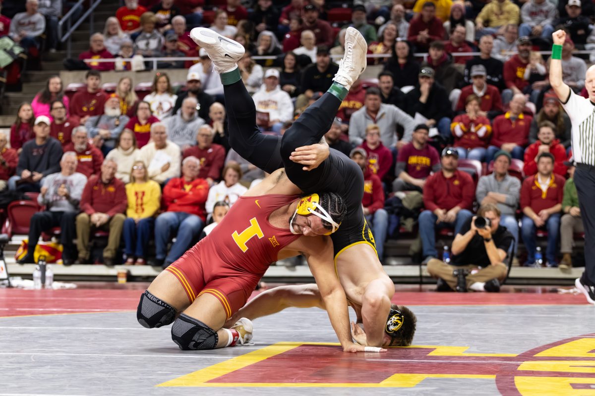 Yonger Bastida flips Sampson Stillwell (MIZ) upside-down. ISU wrestling vs. Missouri, Hilton Coliseum, Ames, Iowa, Feb. 22, 2026.