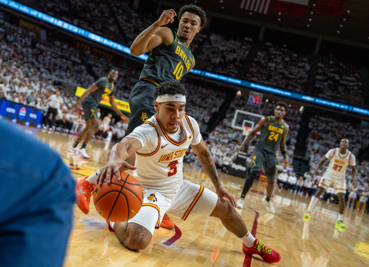 Iowa State guard Tamin Lipsey (3) drops to the ground to prevent the ball from rolling out of bounds during the men’s basketball game vs. Baylor University at Hilton Coliseum in Ames, Iowa, Feb. 7, 2026.