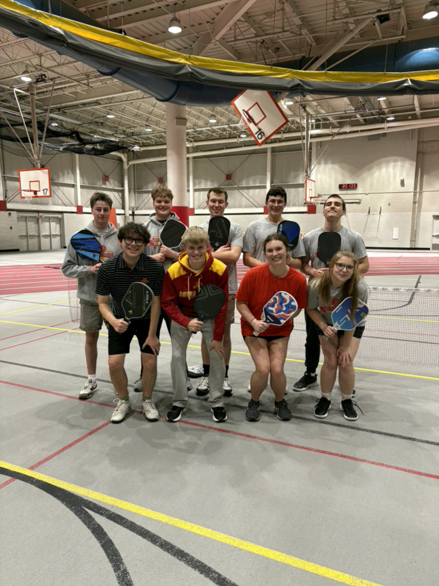 Members of the Pickleball Club pose after a session at Lied. Membership coordinator Ellie Beagle (far right, first row) said that pickleball is a nice way to break the repetition that comes with being a student. Courtesy of Pickleball Club.