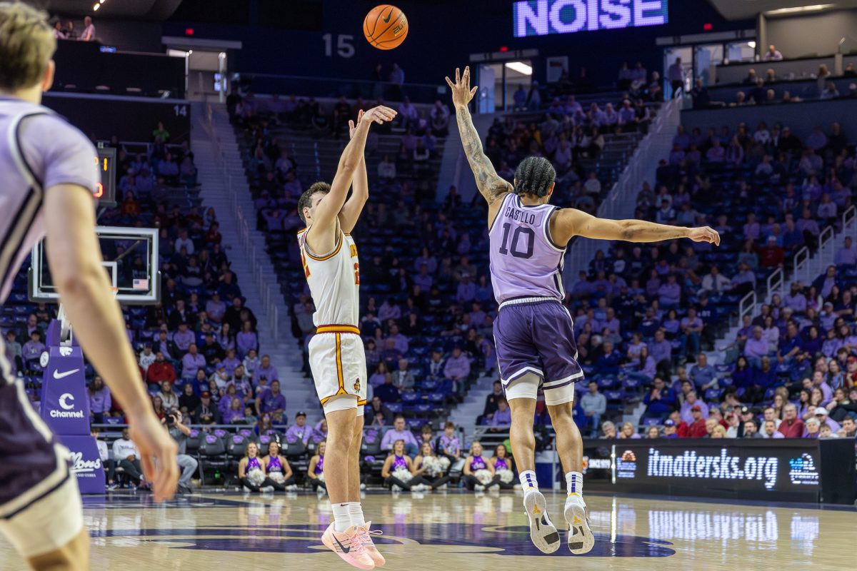 Milan Momcilovic (22) shoots a three pointer during the men's basketball game vs. Kansas State in Bramlage Coliseum in Manhattan, Kansas, Feb. 1, 2026.