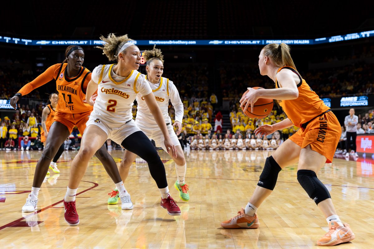 Arianna Jackson (2) and Jada Williams (8) guard against an Oklahoma State player during the Iowa State women's basketball game against Oklahoma State, at Hilton Coliseum in Ames, Iowa, on Feb. 25, 2026.