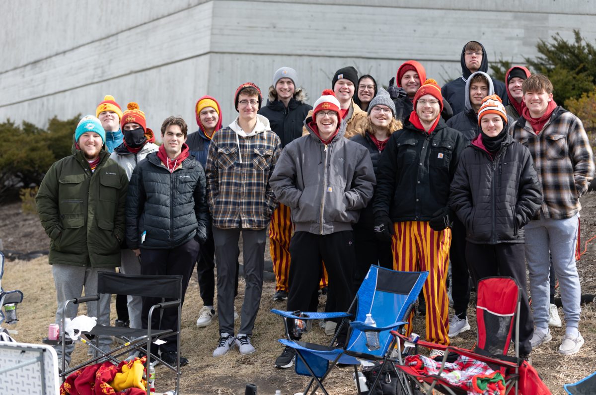 A group of Iowa State fans pose for a group photo while in line for Iowa State vs. Texas Tech, outside Hilton Coliseum, Ames, Iowa, Feb. 28, 2026.