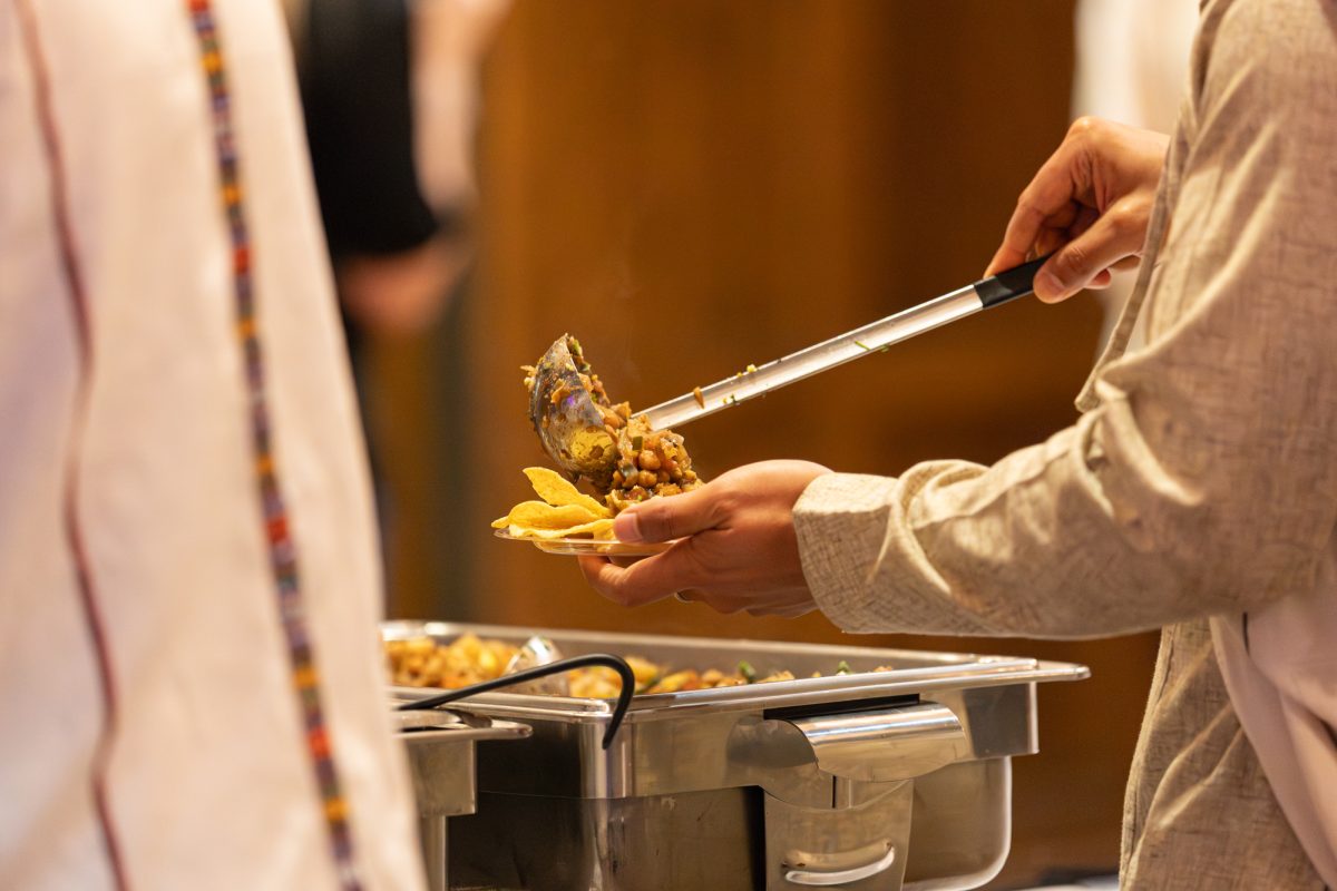 Global Gala participant serving the food provided at the Global Gala, Memorial Union, Ames, Iowa, March 27, 2026.