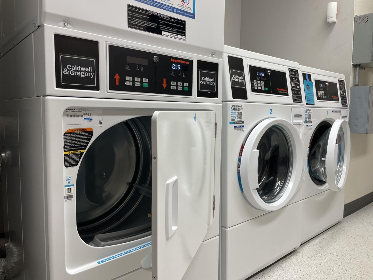 Open washers and dryers in a laundry room inside Martin Hall, Ames, Iowa, March 25, 2026.