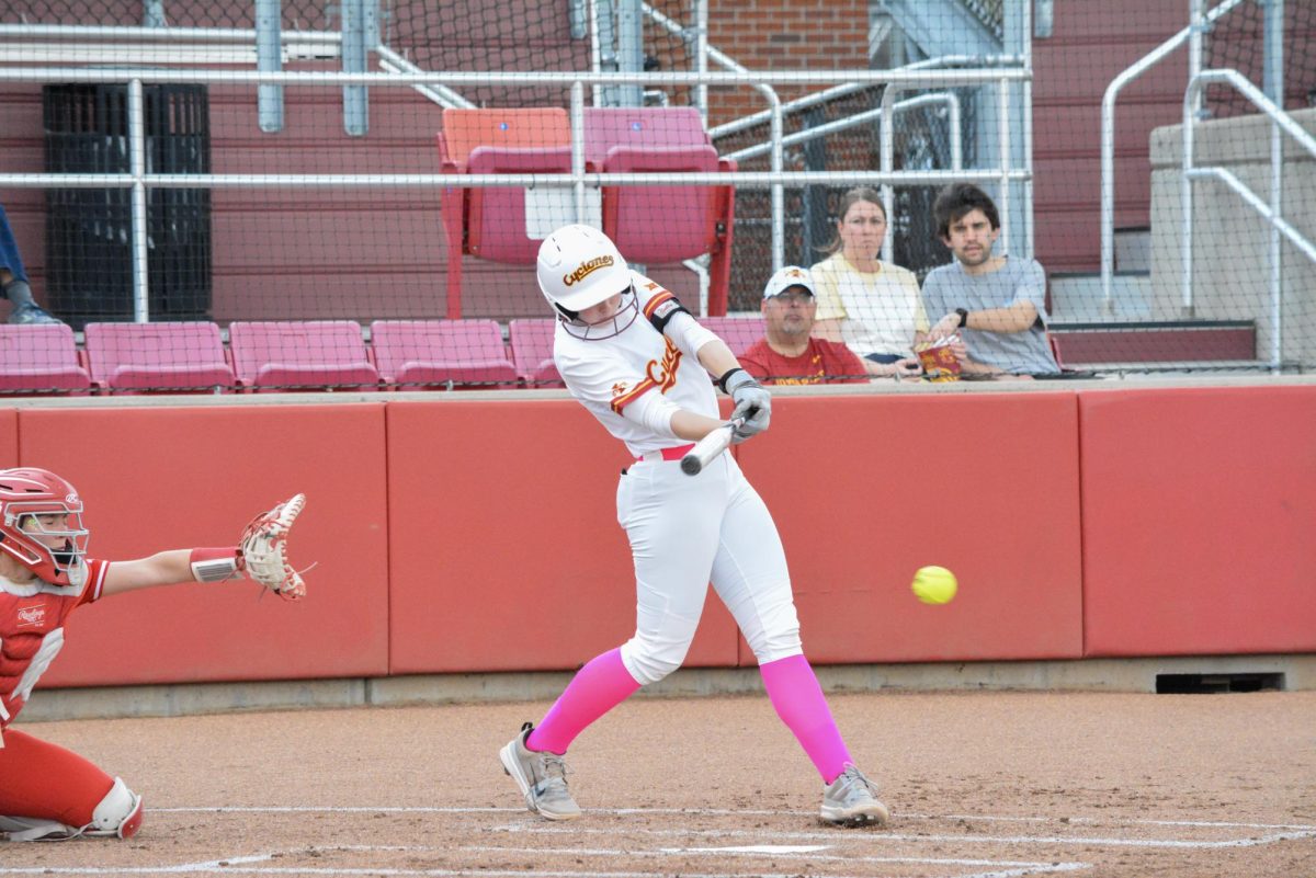 Reagan Bartholomew (24) hitting ball during the Iowa State vs. South Dakota softball game at Cyclone Sports Complex, Ames, Iowa, April 14, 2026.