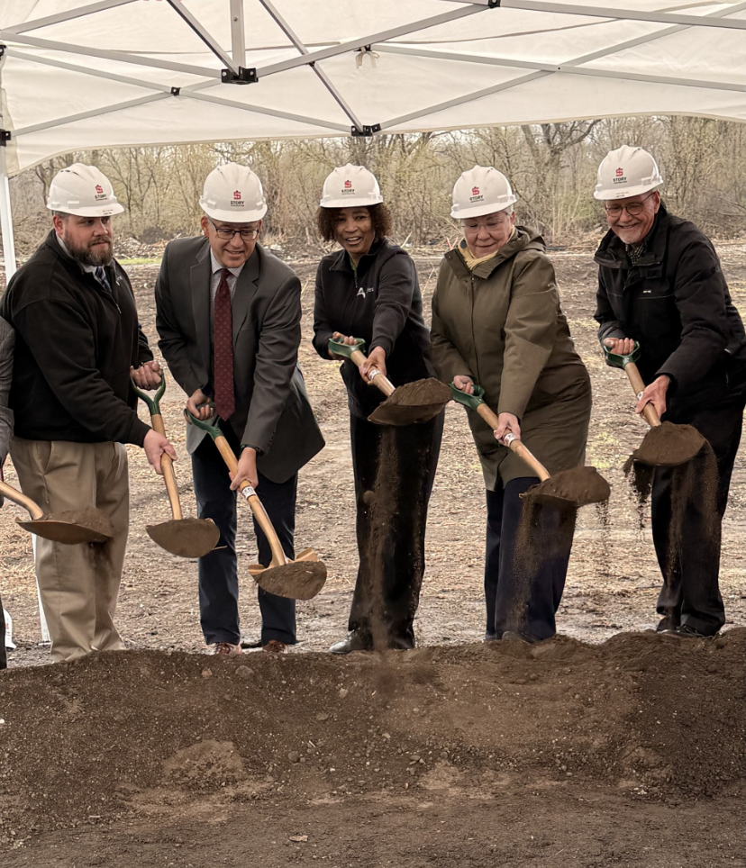 Ames city staff and city council members shoveling dirt on the site of the new Resource Recovery and Recycling Campus at groundbreaking event. April 9, 2026. 