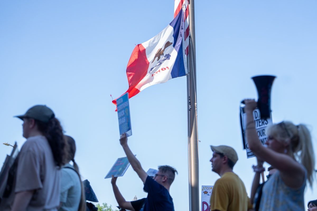Demonstrators protest against the potential LightEdge data center before the Ames City Council meeting at Ames City Hall in Ames, Iowa, July 14, 2026.